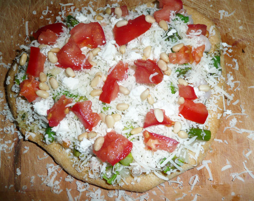 Fully assembled and ready to cook asparagus shrimp pesto pizza