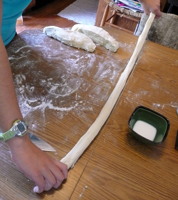 Pulling the dough into a long rope