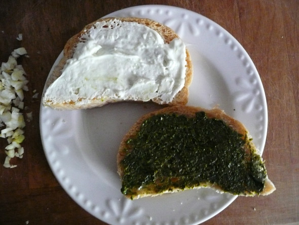 Spread the inside of the slices: one with pesto, one with cheese mixture