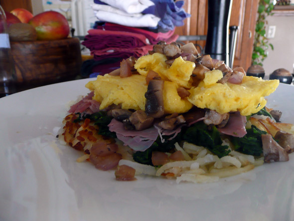 Hashbrowns Supreme with Spinach, Prosciutto, Mushroom, Onion, Egg, and Gouda and Sharp Cheddar Cheese