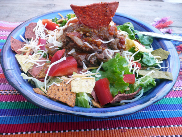 Taco Salad with Beef, Beans, Cheese, Bell Pepper, Onion and Vegie Corn Chips