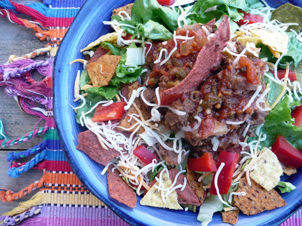 Taco Salad with Beef, Beans, Cheese, Bell Pepper, Onion and Vegie Corn Chips