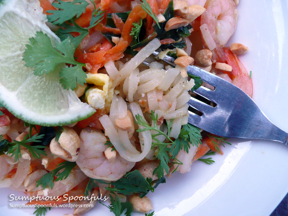 Shrimp Pad Thai: noodles with shrimp, carrots, onion, spinach topped with cilantro & peanuts