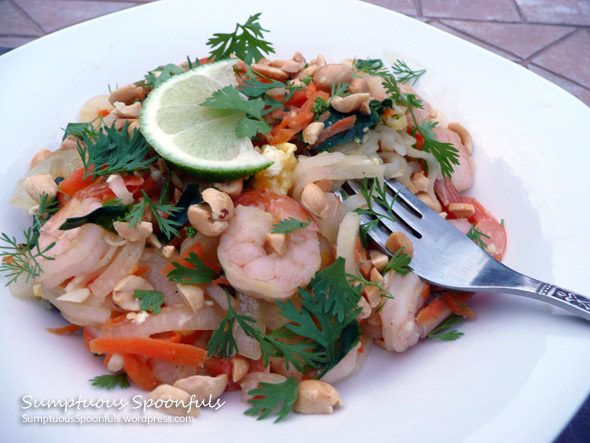 Shrimp Pad Thai: noodles with shrimp, carrots, onion, spinach topped with cilantro & peanuts