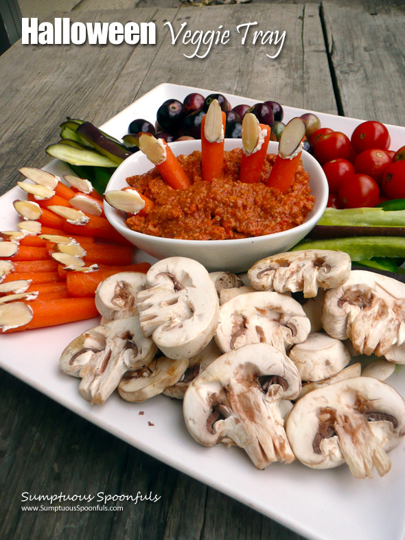 Halloween Veggie Tray with Mushroom "Skulls", Carrot "Fingers" and goblin eyes ~ Sumptuous Spoonfuls #halloween #party #idea