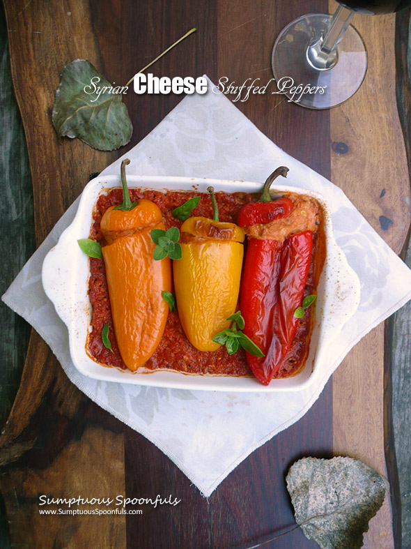 Syrian Cheese Stuffed Peppers ~ mini sweet peppers stuffed with a magical cheese mixture over flavorful Romesco sauce