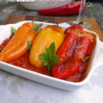 Syrian Cheese Stuffed Peppers ~ mini sweet peppers stuffed with a magical cheese mixture over flavorful Romesco sauce