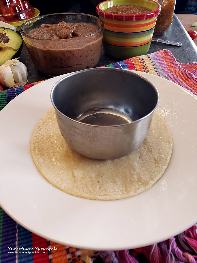 Set a cup on the tortilla while in the air fryer to keep the tortilla from flying around while it's getting crisp.